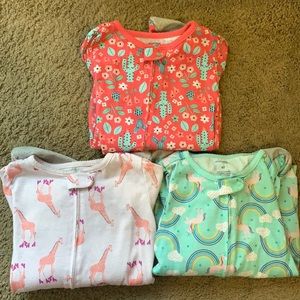 Bundle of 3 zip footed pajamas.